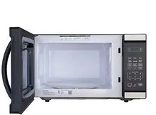 Black + Decker microwave oven with open door showing interior cavity