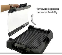 Reversible indoor grill and griddle with removable glass lid over dark ridged surface