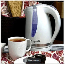MegaChef plastic electric tea kettle, white with blue accent stripe and curved handle