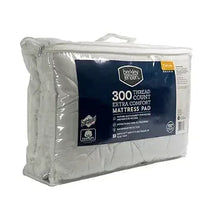Twin-size extra comfort mattress pad, white fill shown through plastic bag