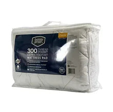 Twin-size extra comfort mattress pad in sealed plastic bag with label