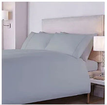 King-size harbor mist sheet set on bed with pillowcases and flat sheet