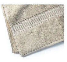 Linen bath towel corner with textured fabric and stitched border trim