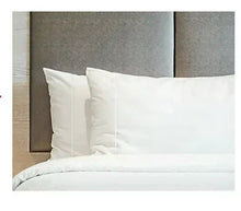 White satin sheet set with pillowcases and matching bed sheets