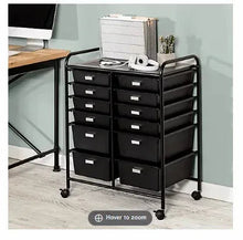 Black rolling craft cart with handle, multiple drawers, and tabletop surface
