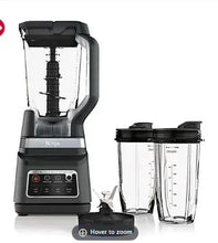 Professional blender with two containers, dark gray base and clear jars.