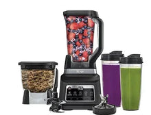 Black countertop blender with clear jar, control panel, and berry-filled pitcher; plus cups.