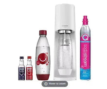 White SodaStream sparkling water maker with bubly soda bottle and drops