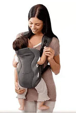 Breathable baby carrier in dark gray, worn on a person with shoulder straps