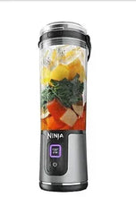 Black portable blender with clear blending cup and blade base, power button display