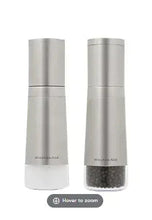 Stainless steel KitchenAid grinder with speckled base and adjustable top