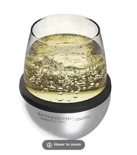 Asobu wine koozie holding wine, stainless steel body with black rim