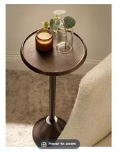 Bronze modern pedestal drink table with round metal top and central column