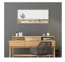 Framed canvas wall art with a desert landscape and a lone Joshua tree