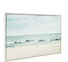 Framed beach canvas wall art with wide ocean horizon and gentle waves in teal