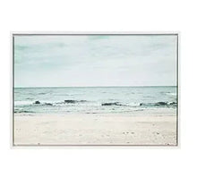 Framed beach canvas wall art with ocean waves and shoreline in soft teal and sand
