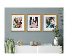 Set of 4 framed wall pictures with gold-tone frames and portrait artwork
