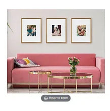 Set of 3 gold wall picture frames with three framed prints, mixed orientations
