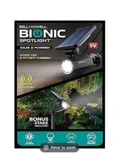 Solar security spotlight with motion-activated LED, shown on retail package