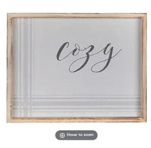 Cozy framed wall art with wooden frame and centered cursive 'cozy' print