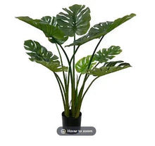 Artificial split-leaf philo tree plant with glossy green leaves in black pot