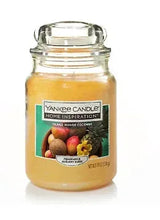 Yankee Candle jar candle with yellow wax in a glass jar and lid