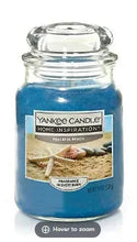 Blue glass jar candle with metal lid and Yankee Candle label, 19 oz Peaceful Beach