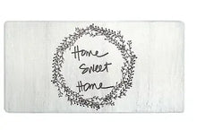 Rectangular anti-fatigue kitchen mat, centered black wreath “Home sweet home”