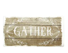 Anti-fatigue kitchen mat with beige base and white "GATHER" floral border print