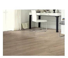 Weathered vinyl plank flooring with light woodgrain, installed in a room