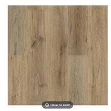 Vinyl plank flooring close-up with light tan wood-grain texture
