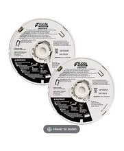 White smoke alarm pair, back labels visible with mounting bracket slots