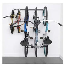 Wall-mounted bike storage rail with hooks, holding multiple bikes by the frames