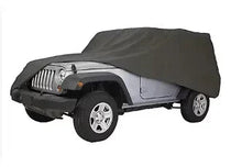 Dark gray SUV cover fitted over Jeep with elastic hem and wheel openings