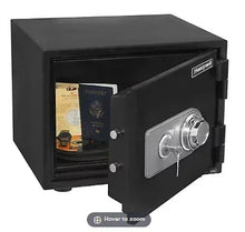 Black fire and security safe with combination dial and key lock, door open