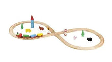 Wooden train set with curved track, small cars, and colorful accessories