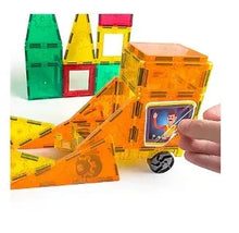 Magnetic construction tile pieces and truck details in orange, green, and yellow