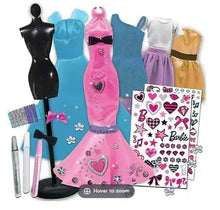 Doll fashion designer set with black mannequin, blue and pink dresses, and sticker sheets
