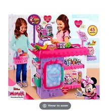 Disney Junior Minnie Mouse toy market playset with pink counter and accessories