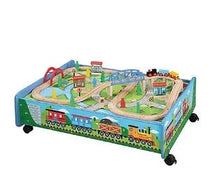Wooden train set play table with colorful track, bridges, and buildings