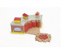 Colorful wooden roundhouse turntable playset with track and small buildings