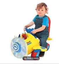 Light-up ride-on plane toy, yellow with red handle; child seated on seat