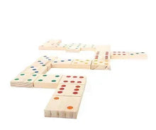 Giant wooden domino tiles with colorful dot patterns arranged in a line