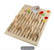Wooden tabletop horse race board game with starting gates and colorful markers