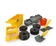 CAT dump truck sand set pieces: yellow bucket, gray/black molds, orange scoop
