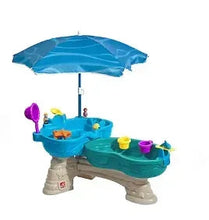 Blue water table with hanging umbrella and molded splash basin
