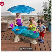 Blue water table with umbrella and splash toys for kids