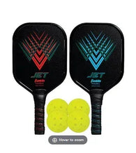 Pickleball set: two black paddles and four yellow balls with multicolor logos
