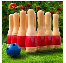 Wooden lawn bowling pins with red stripes and blue ball