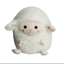 Fuzzy lamb plush with cream body, round black eyes, and pink nose